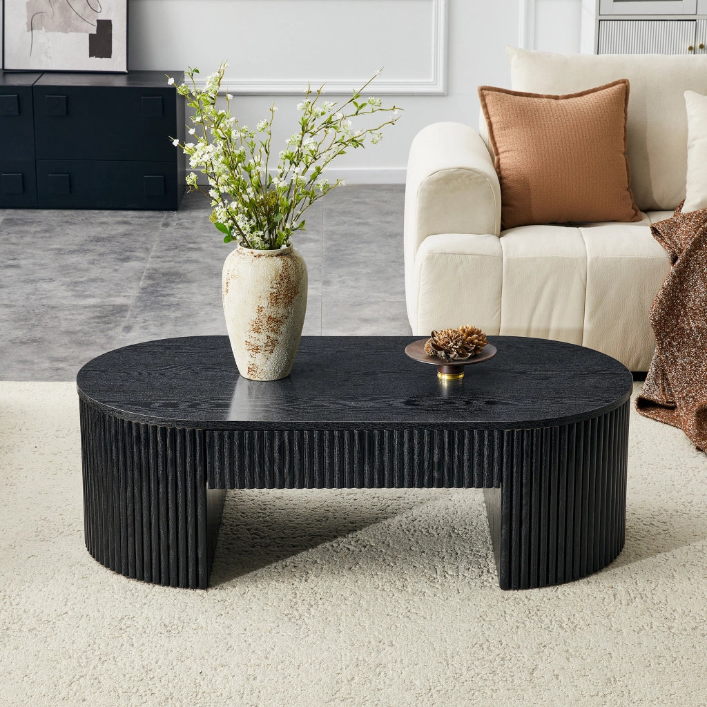 Tavolino basso fisso ovale con cassetto estraibile; rivestimento scanalato effetto legno nero in MDF per soggiorno