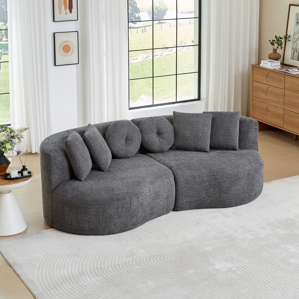 Divano modulare a 2 elementi curvo in chenille grigio con schienale continuo e 6 cuscini assortiti