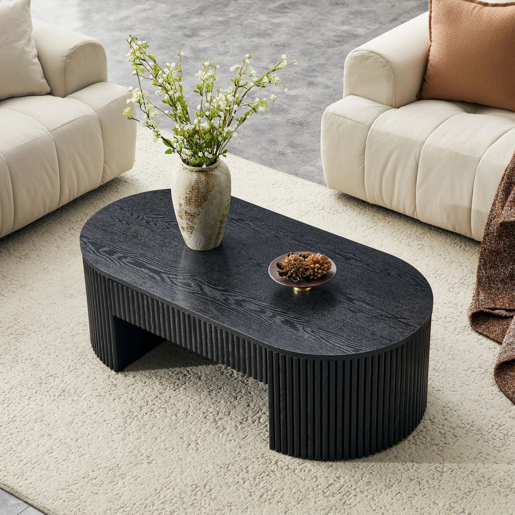 Tavolino basso fisso ovale con cassetto estraibile; rivestimento scanalato effetto legno nero in MDF per soggiorno