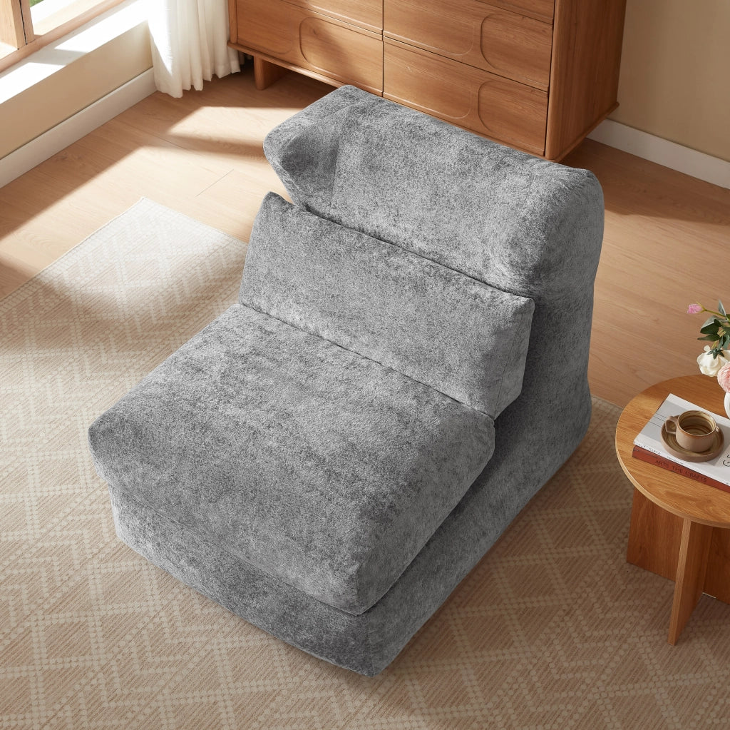 Poltrona ULEVR grigia in schiuma, seduta singola dal design moderno per soggiorno e camera da letto