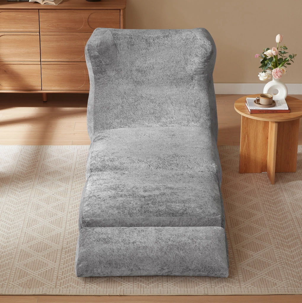 Poltrona ULEVR grigia in schiuma, seduta singola dal design moderno per soggiorno e camera da letto