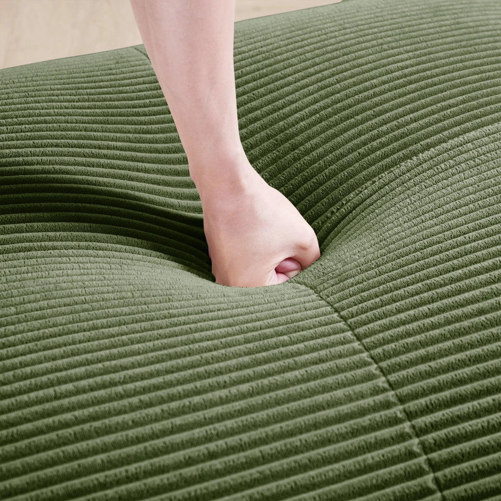 Divano angolare modulare senza struttura; schiuma 32D; braccioli curvi; in velluto a coste verde