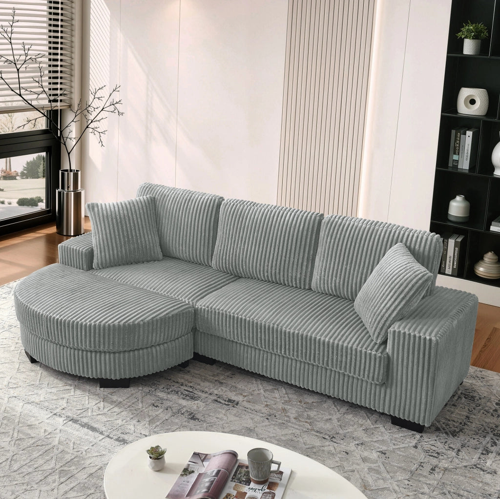Divano angolare ULEVR 256,5x133,5x89 cm con pouf ovale reversibile, 2 cuscini, velluto a coste grigio