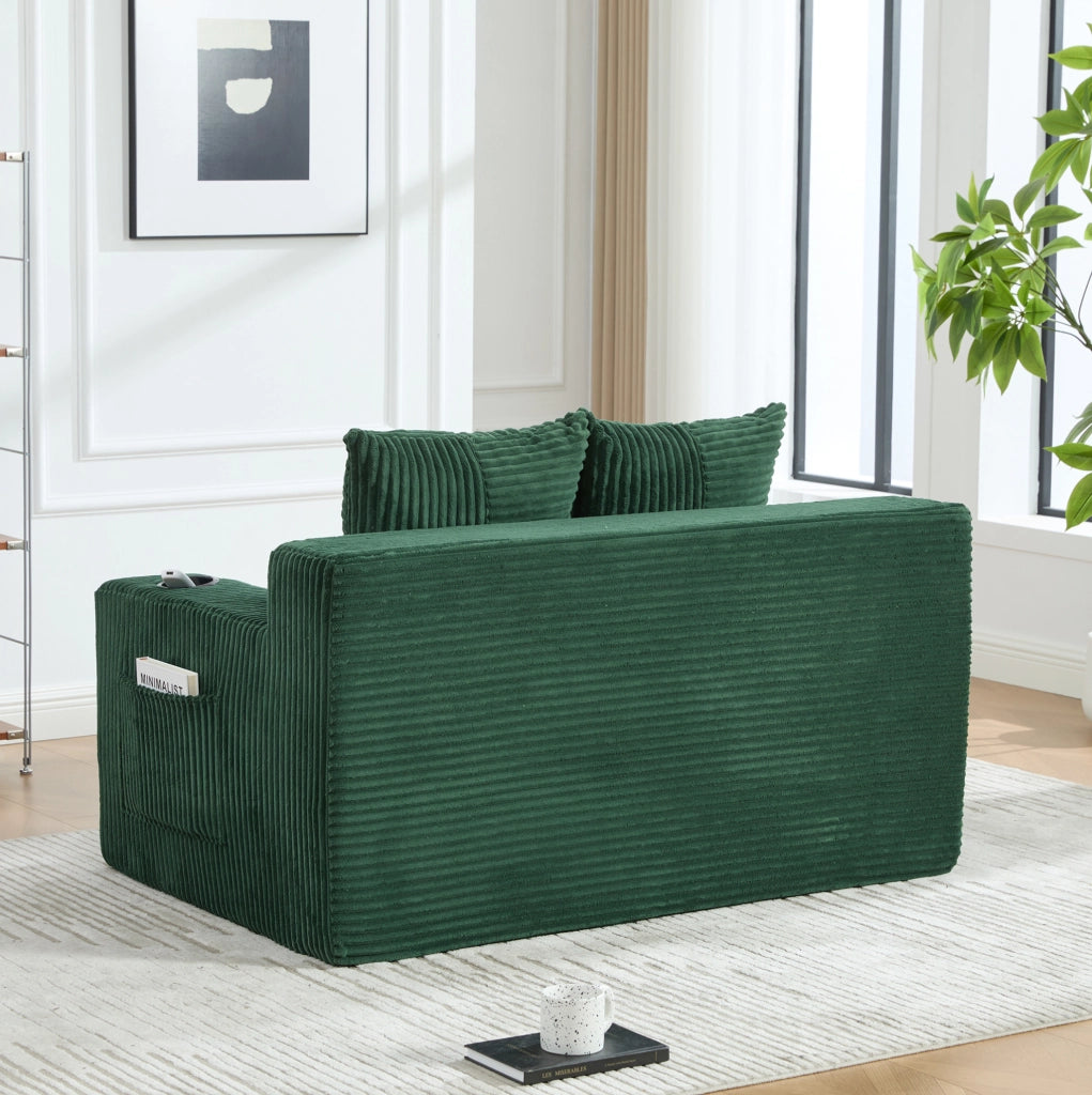 Pouf divano in velluto a coste verde smeraldo con tasche laterali; 151 x 133 x 64 cm