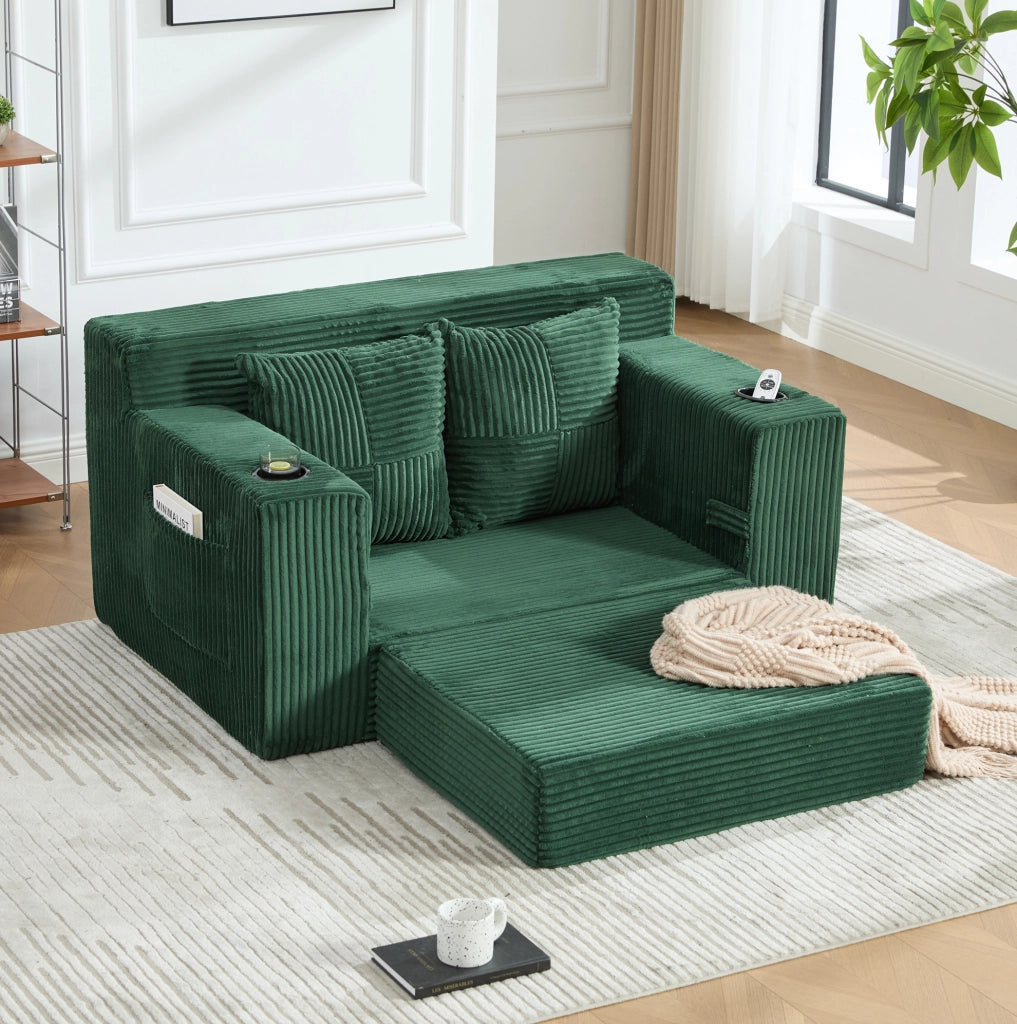 Pouf divano in velluto a coste verde smeraldo con tasche laterali; 151 x 133 x 64 cm