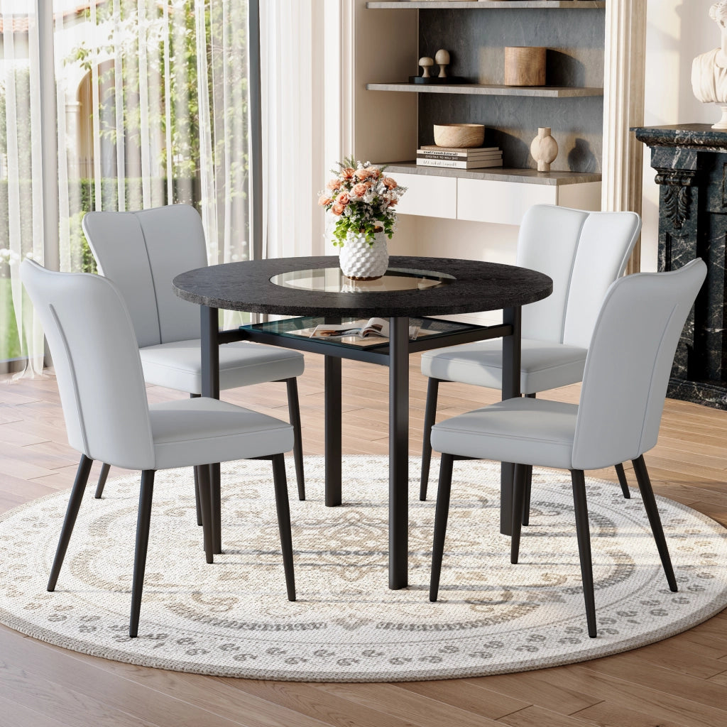 Set da pranzo moderno con tavolo rotondo nero effetto legno 100 cm e 4 sedie grigio chiaro in PU con gambe nere in metallo