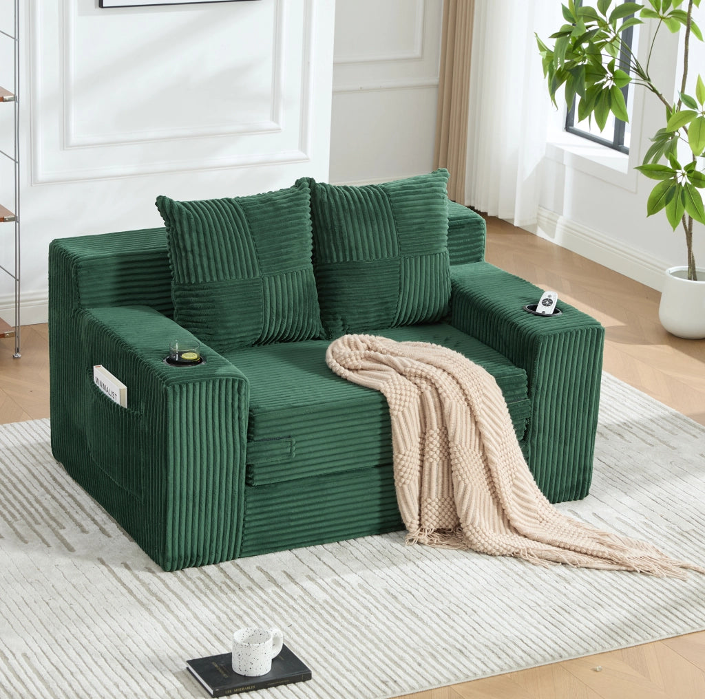 Pouf divano in velluto a coste verde smeraldo con tasche laterali; 151 x 133 x 64 cm