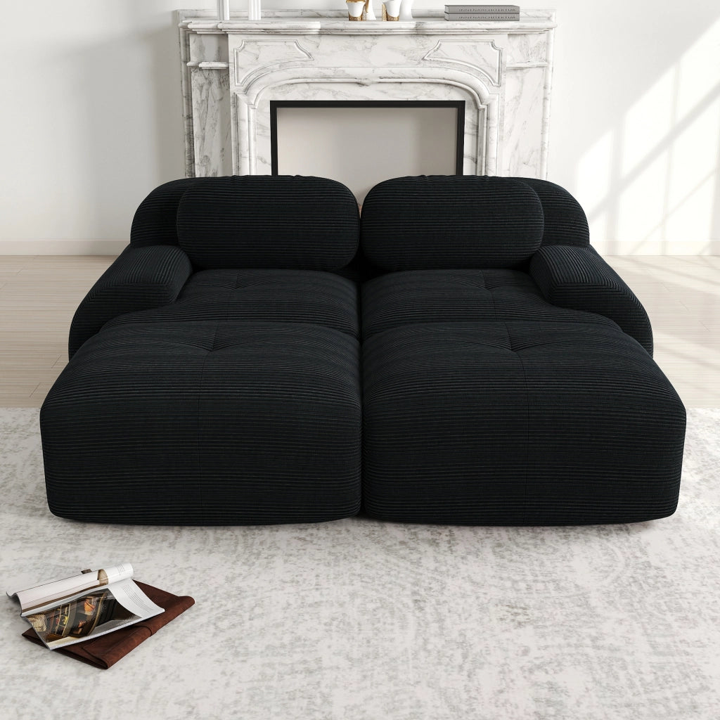 Divano angolare modulare con braccioli ergonomici, imbottito e con base antiscivolo in velluto a coste nero