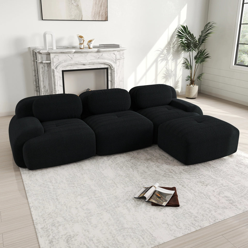 Divano angolare modulare senza montaggio con braccioli curvi ergonomici, in velluto a coste nero