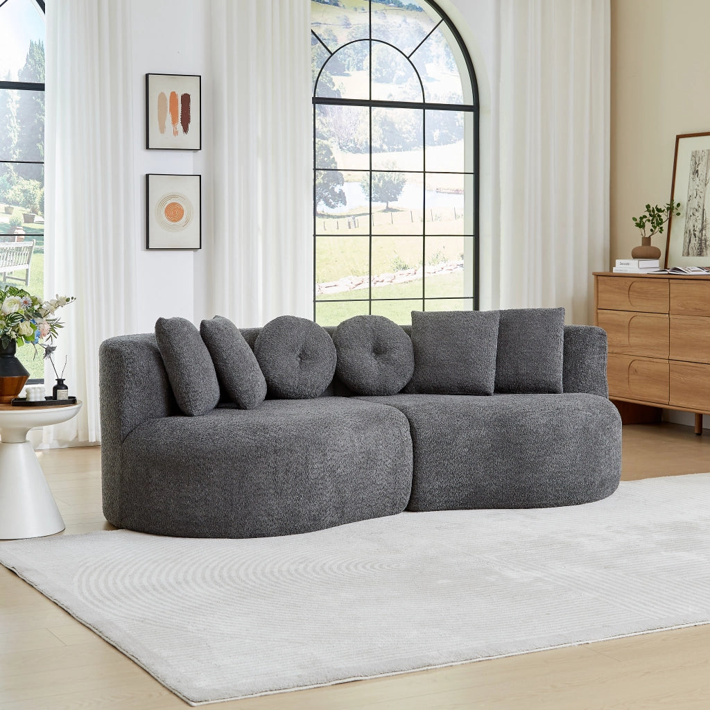 Divano modulare a 2 elementi curvo in chenille grigio con schienale continuo e 6 cuscini assortiti