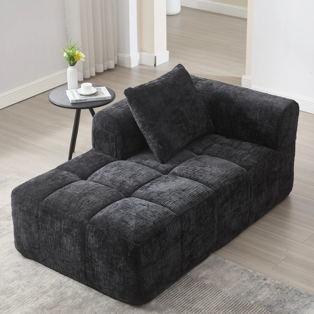 Divano chaise longue 158x90x60 cm in ciniglia nera con tasche laterali e cuscino
