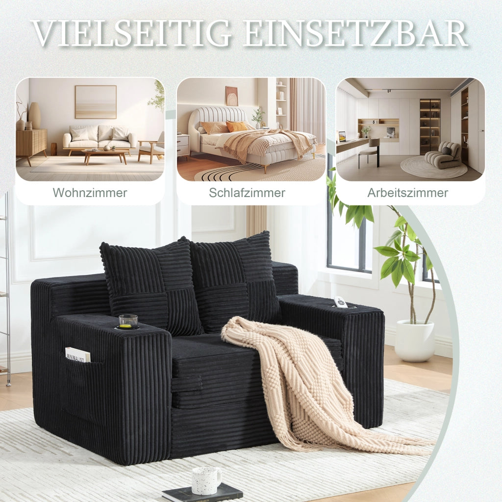 Divano pouf in velluto a coste nero con due cuscini e tasche laterali per lettura e relax