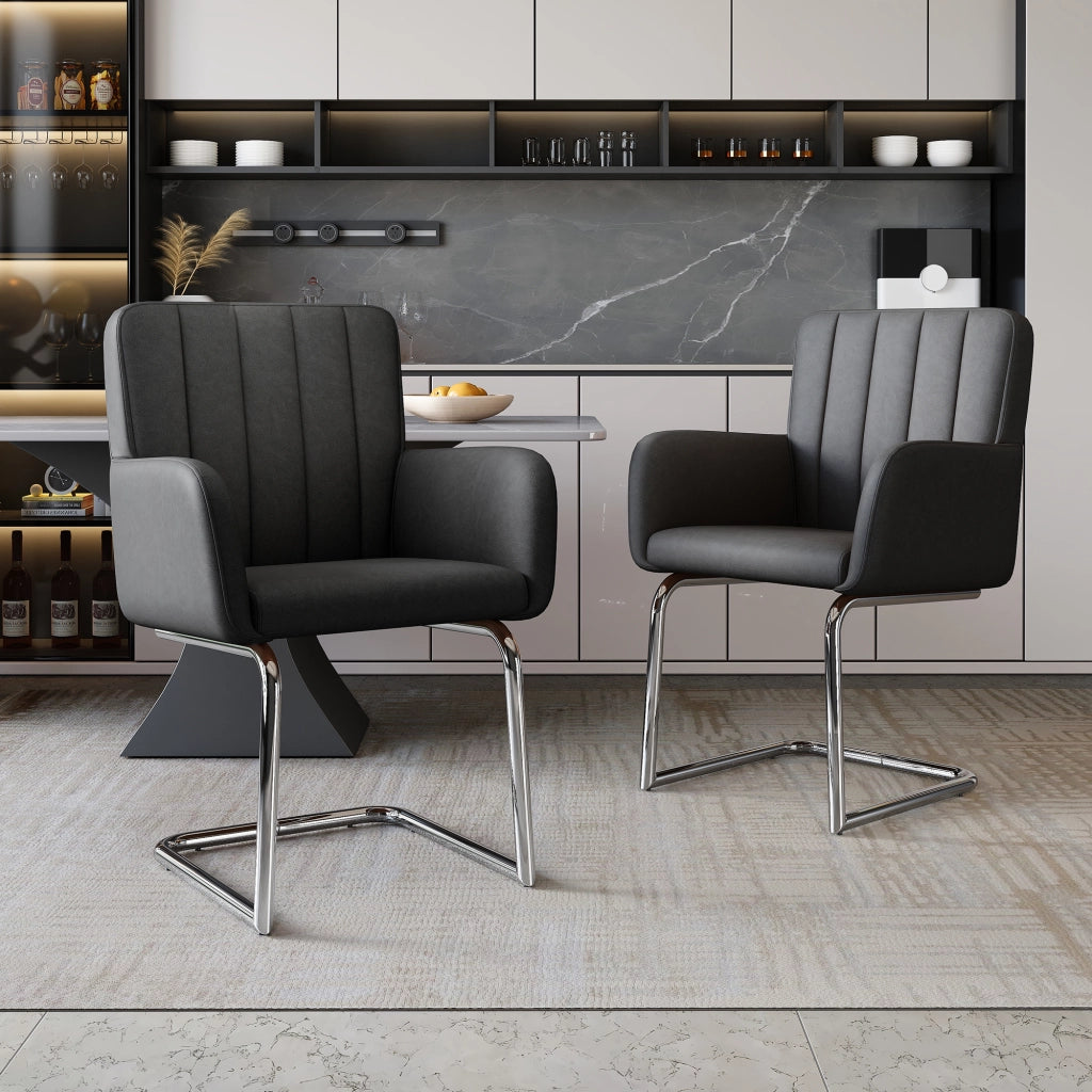 Set di 2 sedie da pranzo con schienale ergonomico e braccioli; gambe in metallo; in similpelle nera