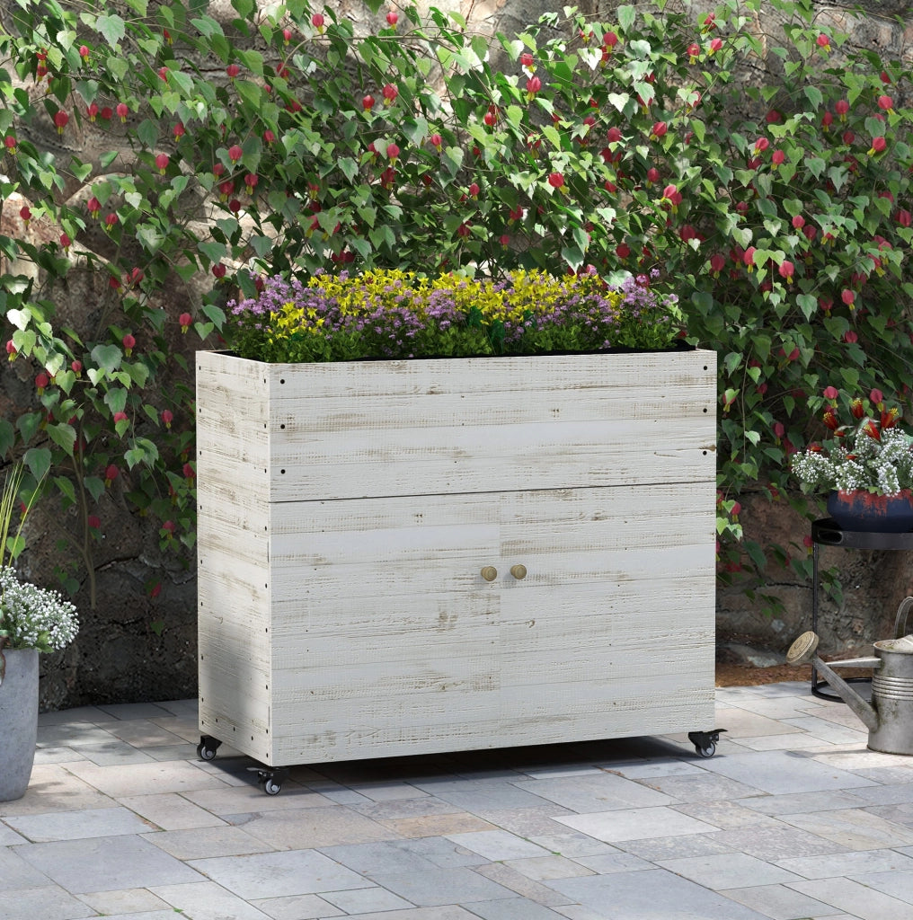 Fioriera alta in legno di abete 110x50x95 cm con vano armadietto, ruote e rivestimento in tessuto non tessuto, bianca