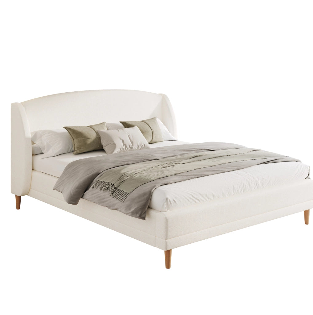 Letto imbottito con testiera ad ali e rivestimento bouclé
