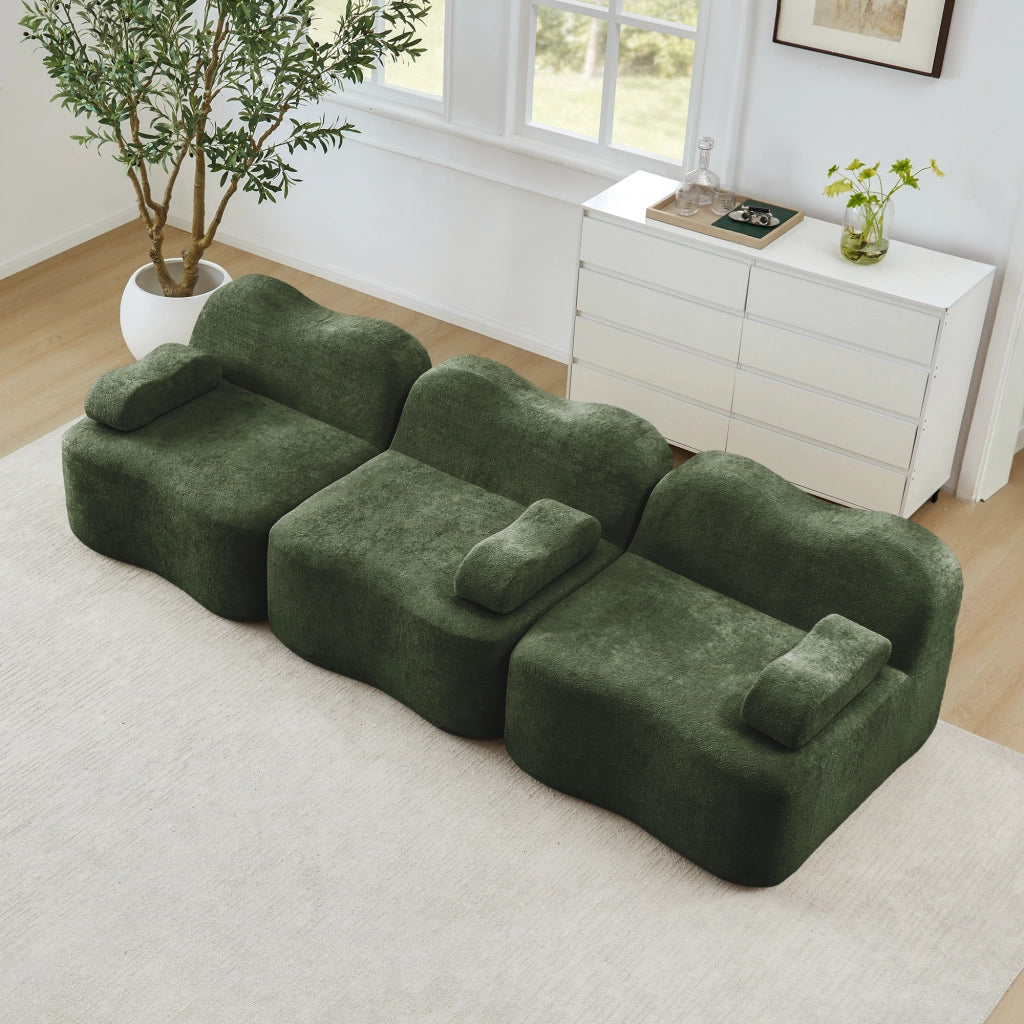 Divano angolare modulare senza struttura interna in velluto verde con seduta profonda e pouf collegabile ondulato