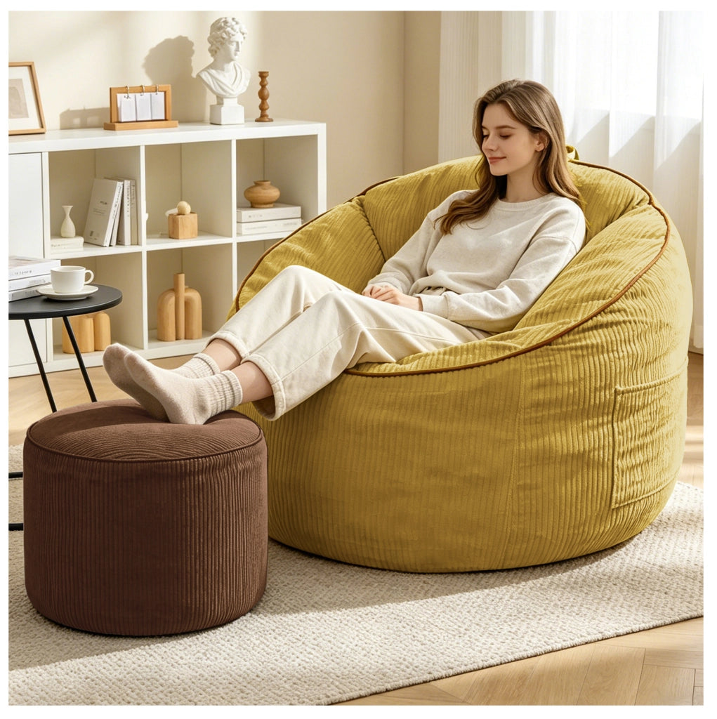 Poltrona curva ergonomica gialla con tasca laterale e pouf cilindrico
