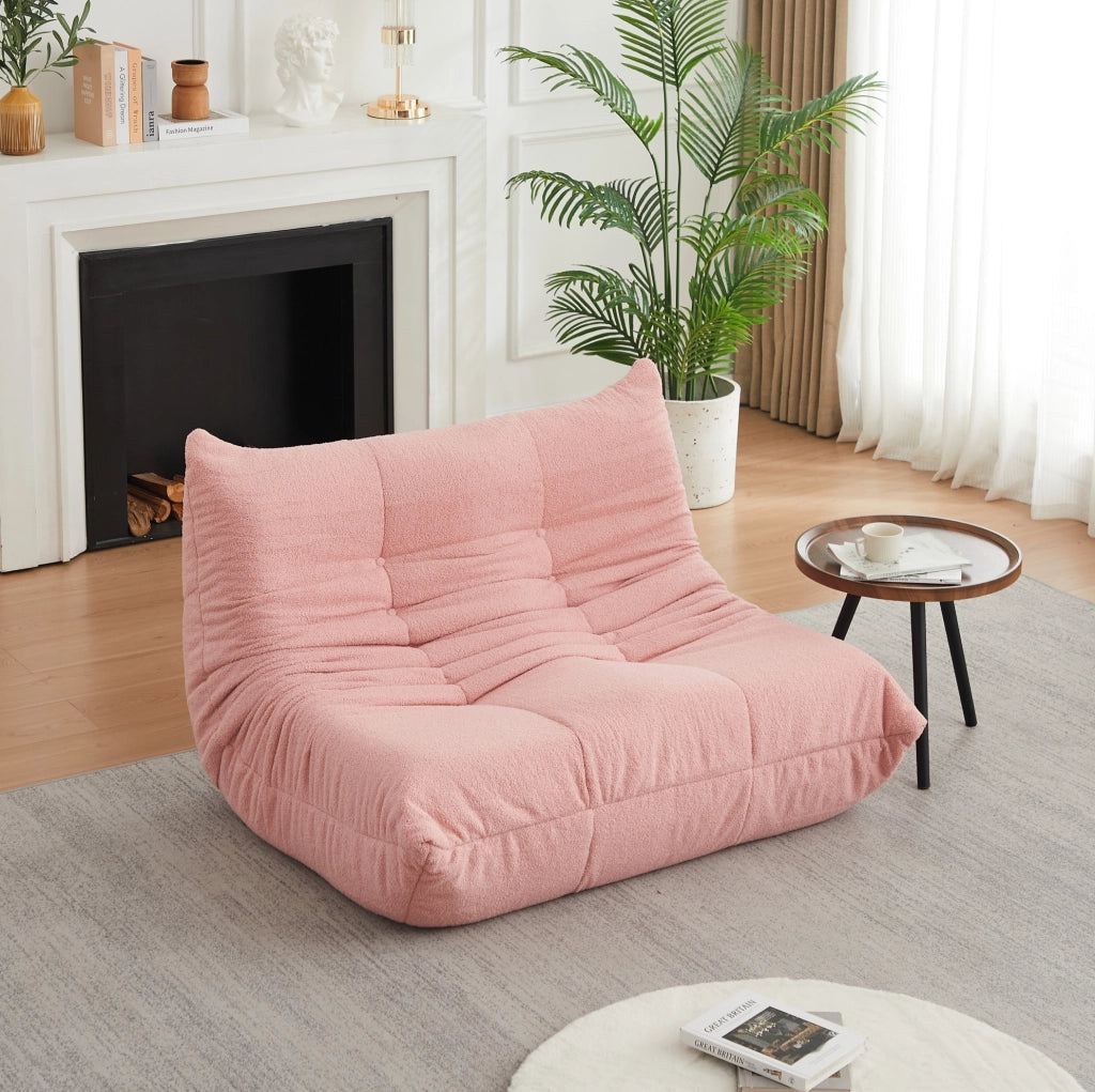 Poltrona da pavimento ULEVR 115 cm in tessuto teddy rosa, imbottitura in schiuma elastica e design con bottoni