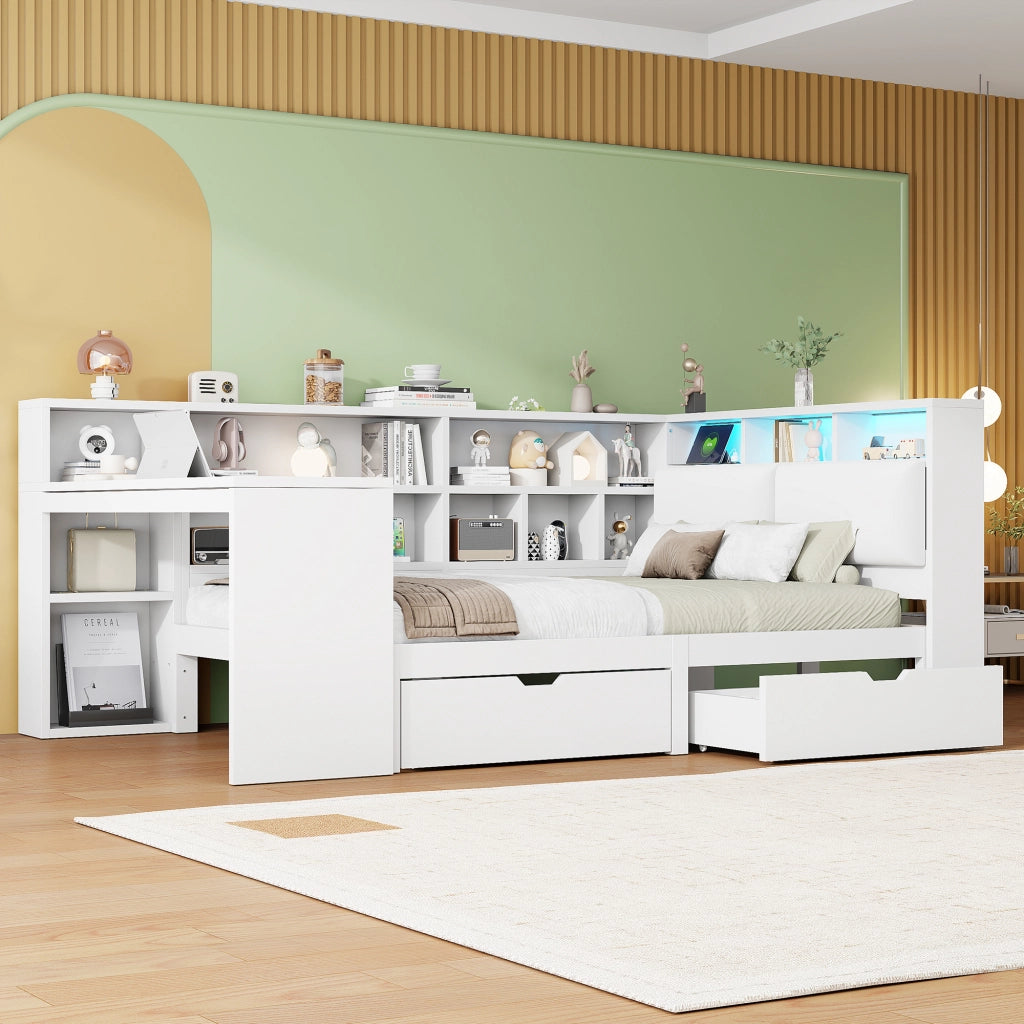Letto a piattaforma a L bianco in MDF e compensato 140×200 cm con scrivania, libreria aperta, contenitore sopra la testata e LED