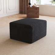 Pouf in tessuto nero senza montaggio