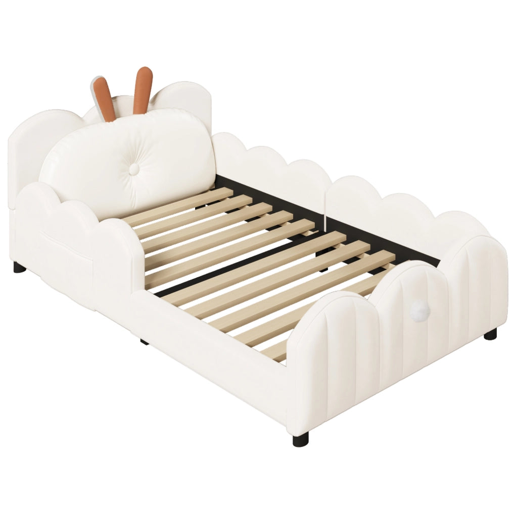 Letto piattaforma imbottito beige 90x200 cm con cuscino a forma di coniglio