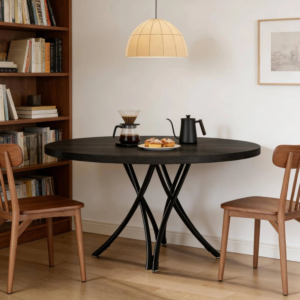 Tavolo da pranzo rotondo nero 120 cm per 4-6 persone con gambe a croce in stile moderno