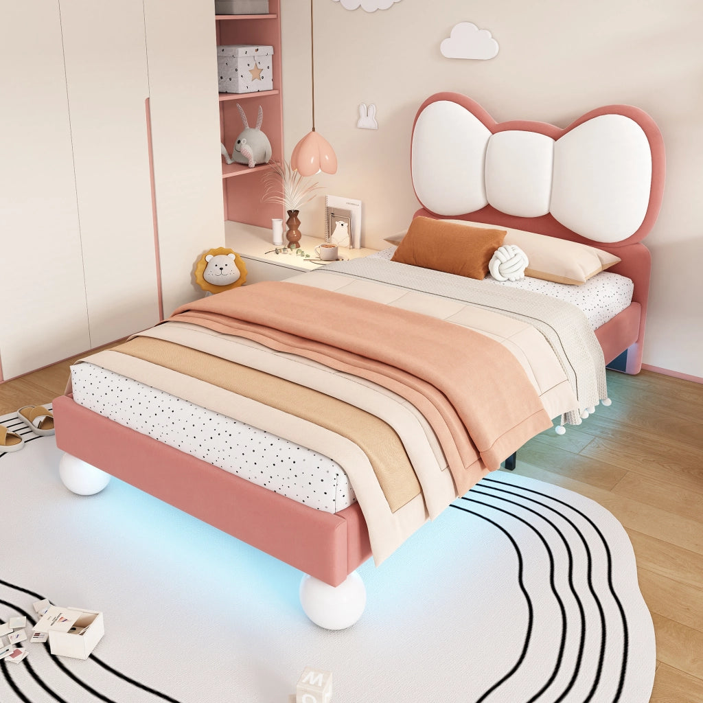 Letto singolo 90x200 cm in velluto rosa con testiera a fiocco e LED