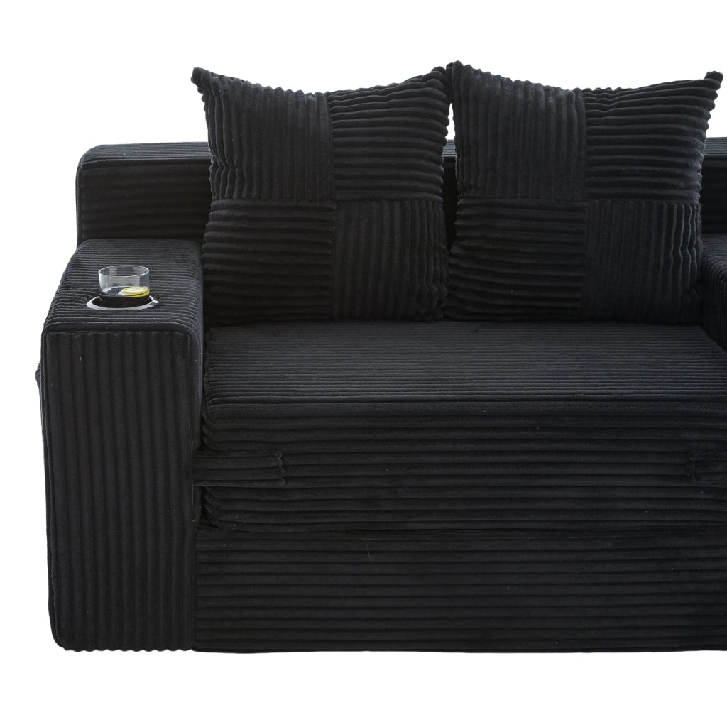 Divano pouf in velluto a coste nero con due cuscini e tasche laterali per lettura e relax
