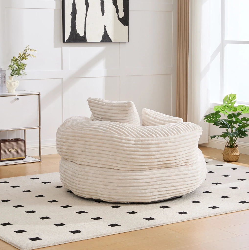 Poltrona sacco in velluto a coste con schienale alto e braccioli; beige; 108x108x52 cm