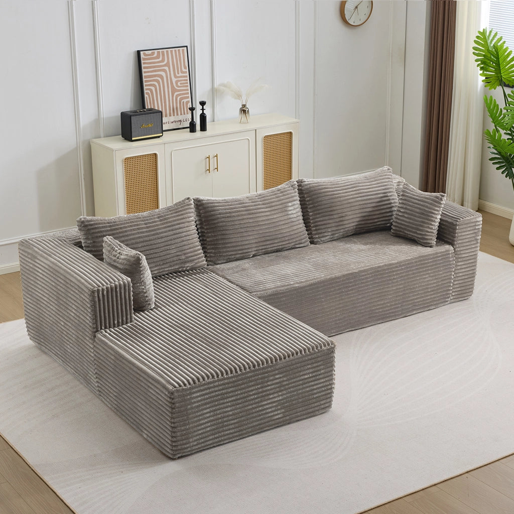 Divano angolare modulare con chaise longue e seduta profonda, senza montaggio, in velluto a coste grigio