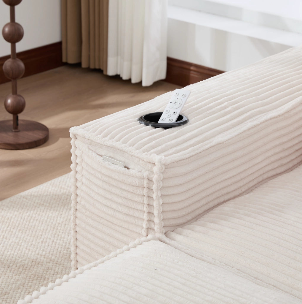 Divano modulare beige in velluto a coste con pouf e portabicchieri