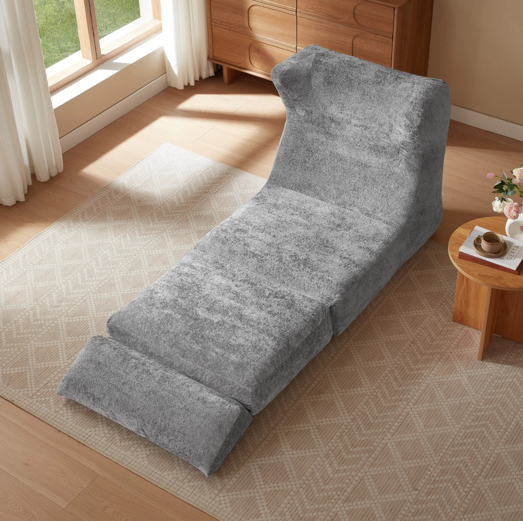 Poltrona ULEVR grigia in schiuma, seduta singola dal design moderno per soggiorno e camera da letto