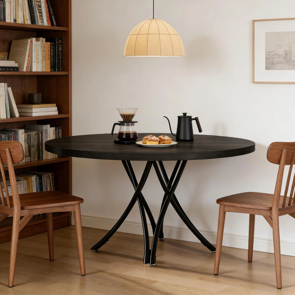 Tavolo da pranzo rotondo con gambe incrociate in legno nero opaco per 4–6 persone diametro 120 cm
