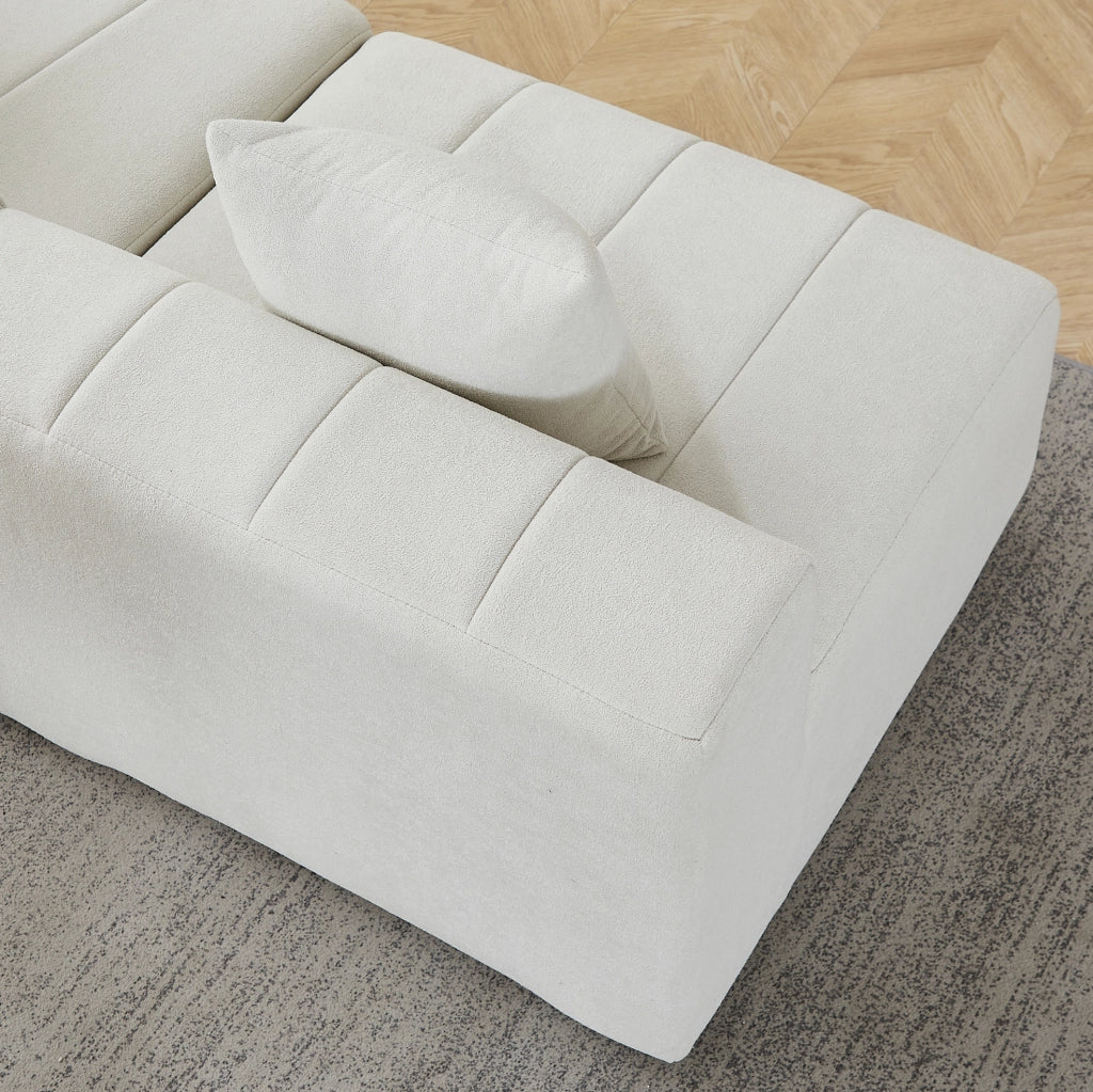 Divano modulare in chenille beige con design a tasti