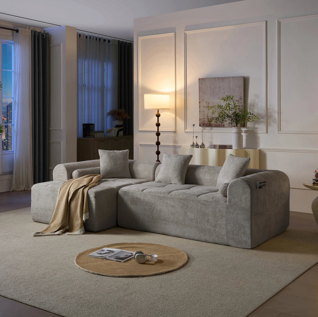 Divano angolare in tessuto chenille grigio chiaro 263 cm con schienale ergonomico e tasca laterale porta riviste