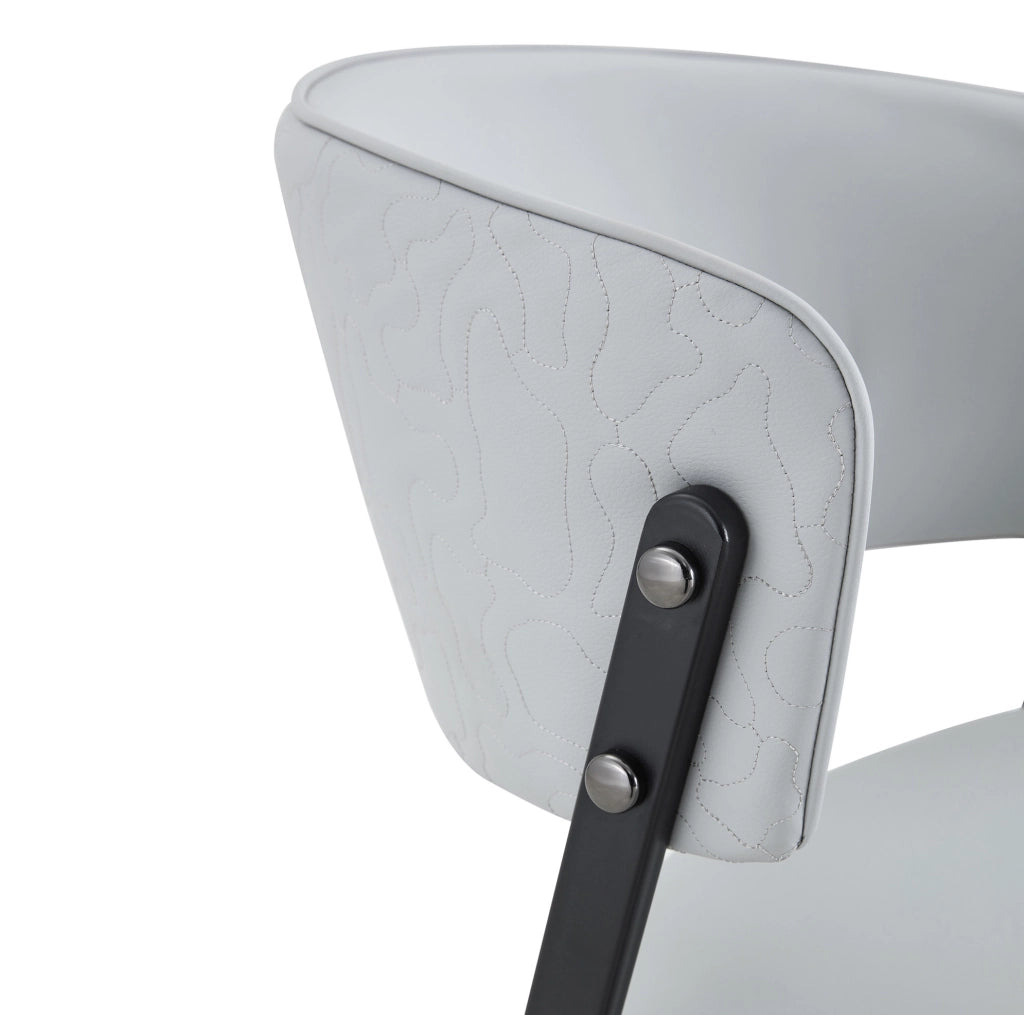 Set di 2 sedie da pranzo ULEVR con seduta e schienale imbottiti, struttura in metallo e rivestimento in PU grigio chiaro