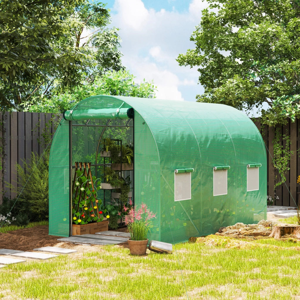 Serra a tunnel in plastica verde con porte e finestre avvolgibili