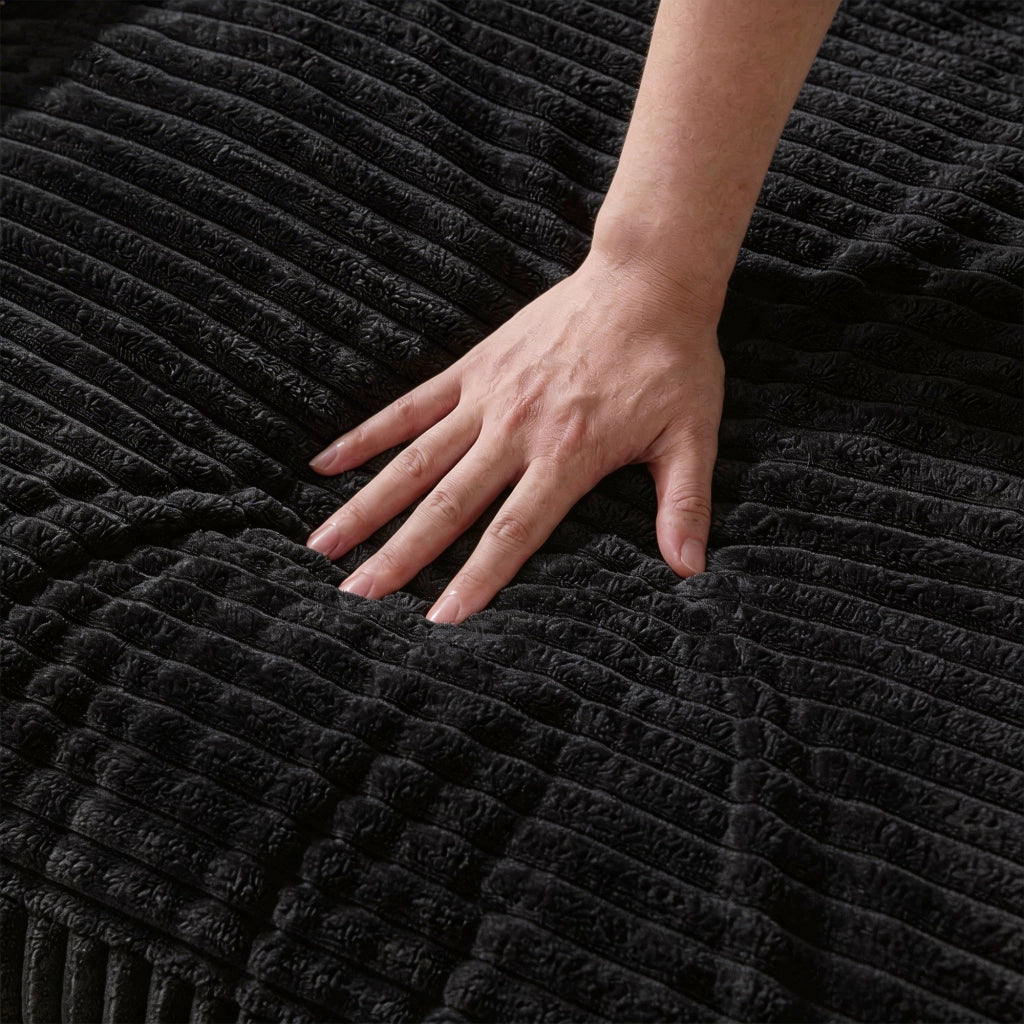 Divano modulare a L con chaise longue reversibile in velluto a coste nero
