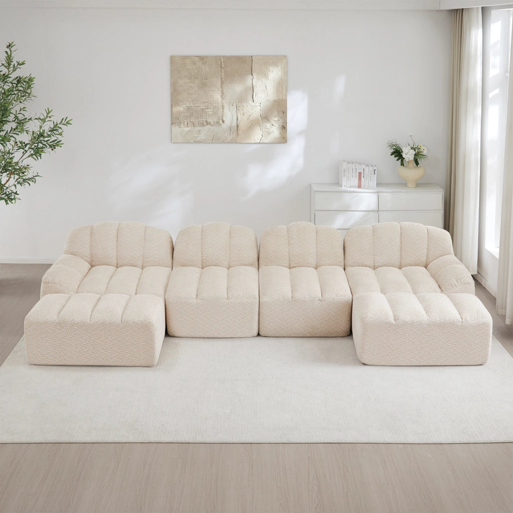 Divano panoramico modulare a 4 posti in pile granulato beige bianco con seduta ampia e pouf collegabile