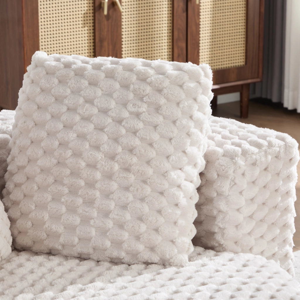 Poltrona compatta con pouf, design avvolgente e rivestimento in tessuto