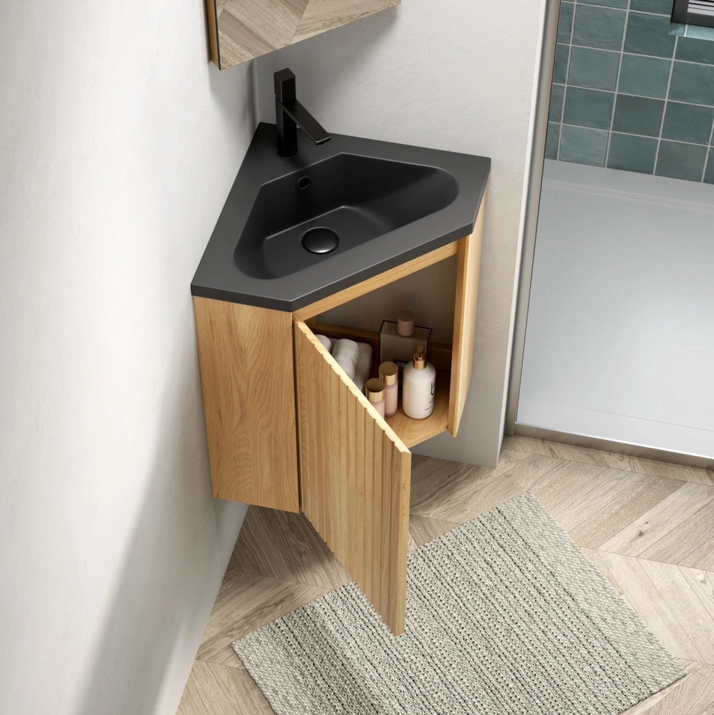 Mobile bagno angolare ULEVR con lavabo triangolare integrato in resina nera opaca e anta effetto rovere