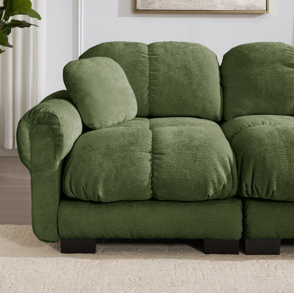 Divano angolare a 3 posti in chenille verde con ottomana mobile e cuscini decorativi