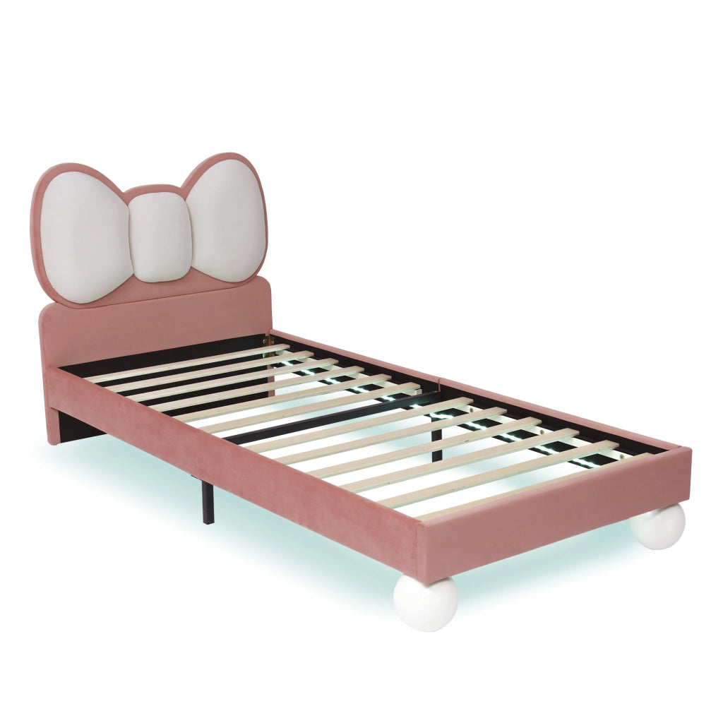 Letto singolo 90x200 cm in velluto rosa con testiera a fiocco e LED