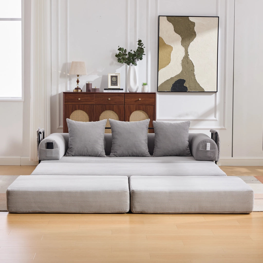 Divano modulare 200x190x67 cm con pouf; tasca laterale e 3 cuscini; velluto a coste grigio chiaro