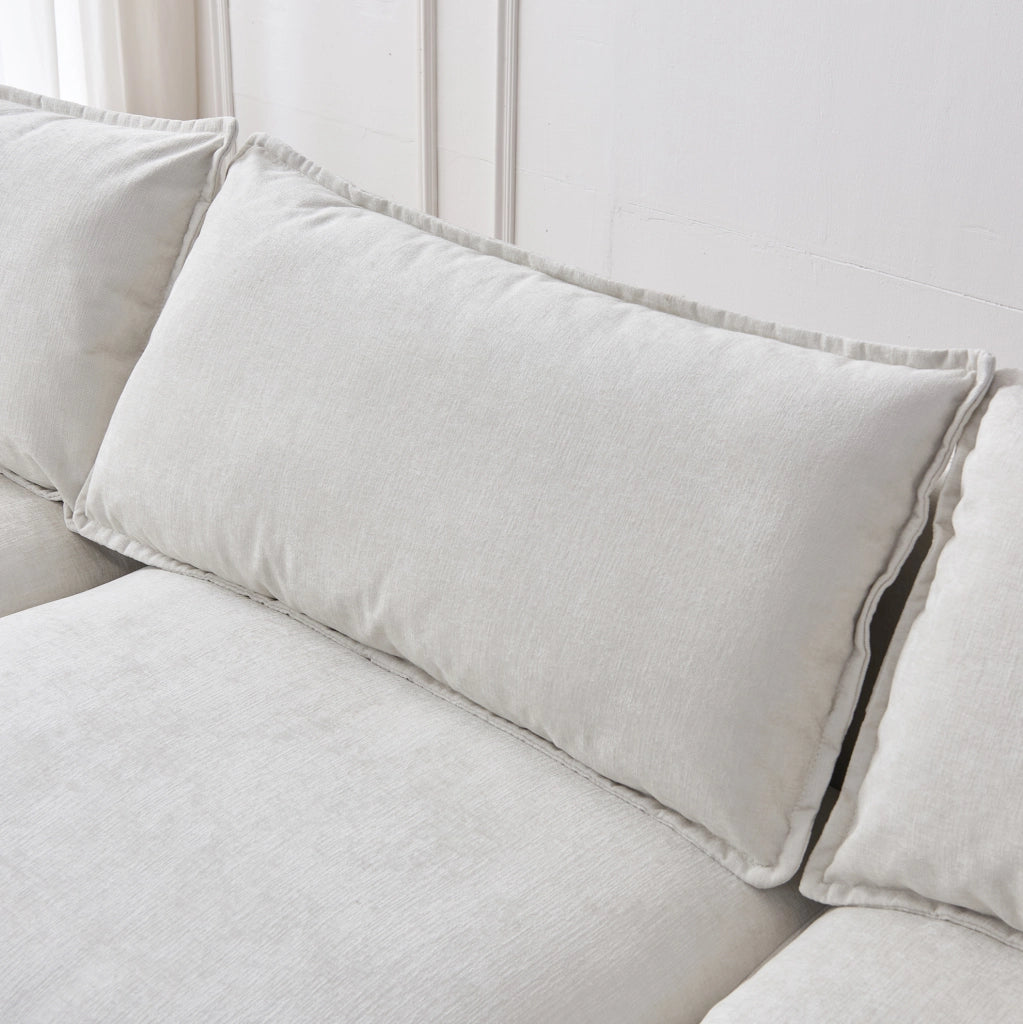 Divano angolare modulare a L 3 posti con chaise longue e pouf in tessuto chenille premium