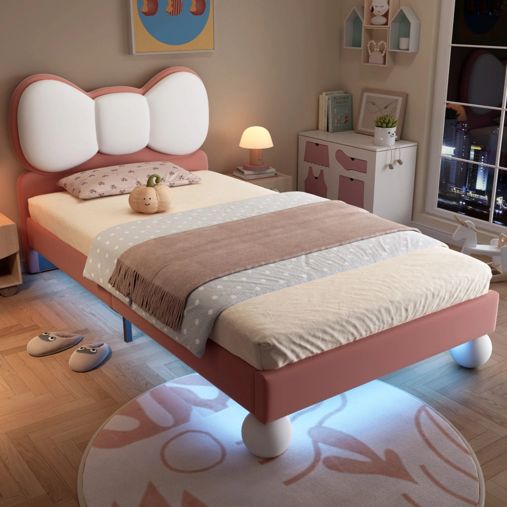 Letto singolo 90x200 cm in velluto rosa con testiera a fiocco e LED