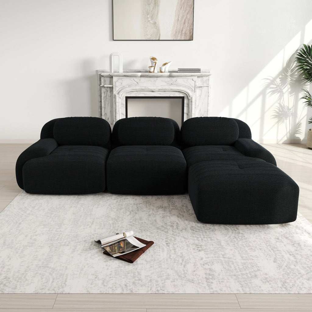 Divano angolare modulare senza montaggio con braccioli curvi ergonomici, in velluto a coste nero