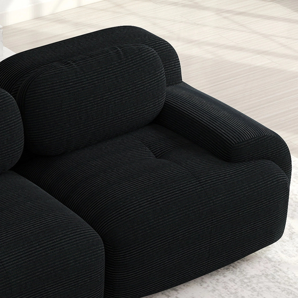 Divano angolare modulare senza montaggio con braccioli curvi ergonomici, in velluto a coste nero
