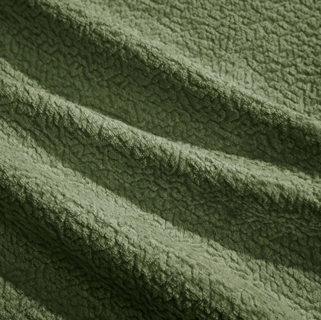 Divano angolare a 3 posti in chenille verde con ottomana mobile e cuscini decorativi