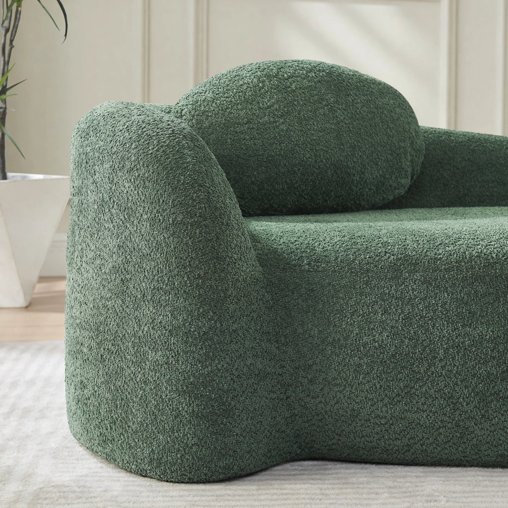 Divano compatto dal design arrotondato in tessuto teddy verde con poggiatesta